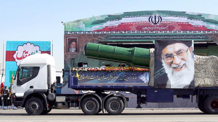 A military truck carrying a missile and a picture of Iran's Supreme Leader Ayatollah Ali Khamenei is seen during a parade marking the anniversary of the Iran-Iraq war (1980-88), in Tehran September 22, 2015. REUTERS/Raheb Homavandi/TIMAATTENTION EDITORS - THIS PICTURE WAS PROVIDED BY A THIRD PARTY. REUTERS IS UNABLE TO INDEPENDENTLY VERIFY THE AUTHENTICITY, CONTENT, LOCATION OR DATE OF THIS IMAGE. FOR EDITORIAL USE ONLY. NOT FOR SALE FOR MARKETING OR ADVERTISING CAMPAIGNS. NO THIRD PARTY SALES. NOT FOR USE 