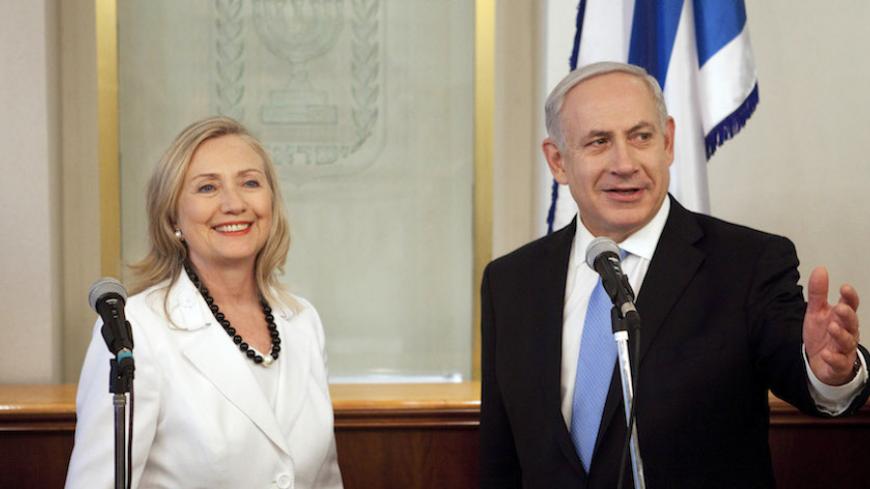 Israel's Prime Minister Benjamin Netanyahu (R) gestures during his meeting with U.S. Secretary of State Hillary Clinton in Jerusalem July 16, 2012. Clinton, arriving in Jerusalem from newly Islamist-controlled Egypt, told a wary Israel on Monday to treat the Arab Spring as an opportunity as well as a source of uncertainty convulsing the Middle East. REUTERS/Abir Sultan/Pool (JERUSALEM - Tags: POLITICS) - RTR34ZPE