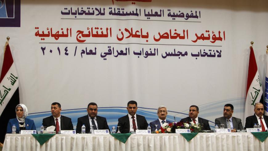 Members of the Independent High Electoral Commission (IHEC) attend a news conference to announce the final results of the parliamentary election in Baghdad May 19, 2014. Prime Minister Nouri Maliki won the largest share of Iraqi parliamentary seats in last month's national elections, dealing a blow to Shi?ite, Sunni and Kurdish rivals who opposed his serving a third term.   REUTERS/Ahmed Saad  (IRAQ - Tags: ELECTIONS POLITICS) - RTR3PUN0