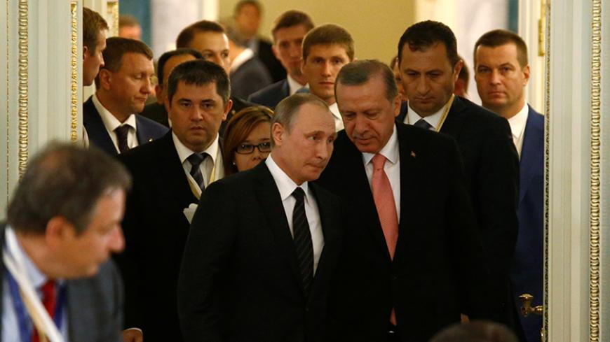 Russian President Vladimir Putin and Turkish President Tayyip Erdogan enter a hall during a meeting with Russian and Turkish entrepreneurs at the Konstantinovsky Palace in St. Petersburg, Russia, August 9, 2016.  REUTERS/Sergei Karpukhin - RTSM63F