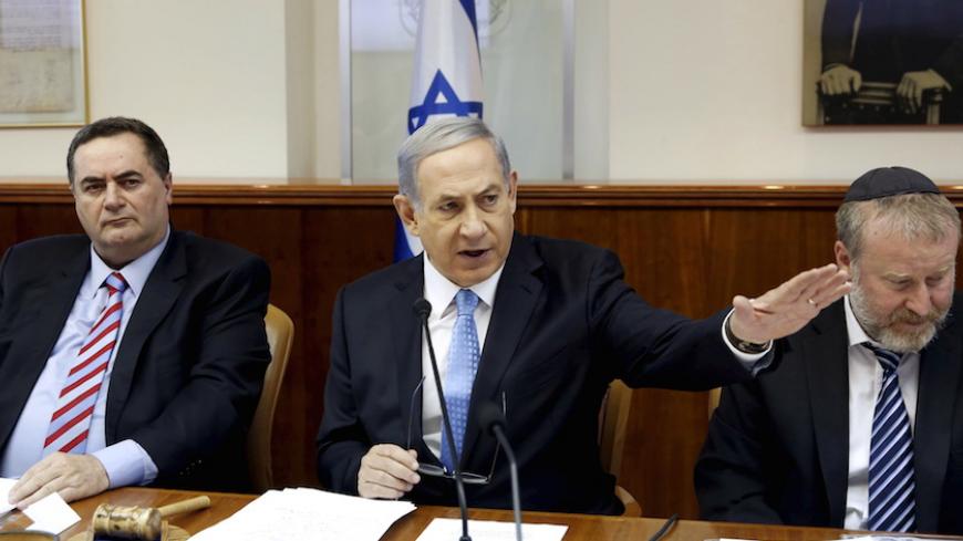 Israel's Prime Minister Benjamin Netanyahu (C), Transportation Minister Yisrael Katz (L) and Cabinet Secretary Avichai Mandelblit attend the weekly cabinet meeting in Jerusalem June 14, 2015. REUTERS/Gali Tibbon/Pool - RTX1GF15