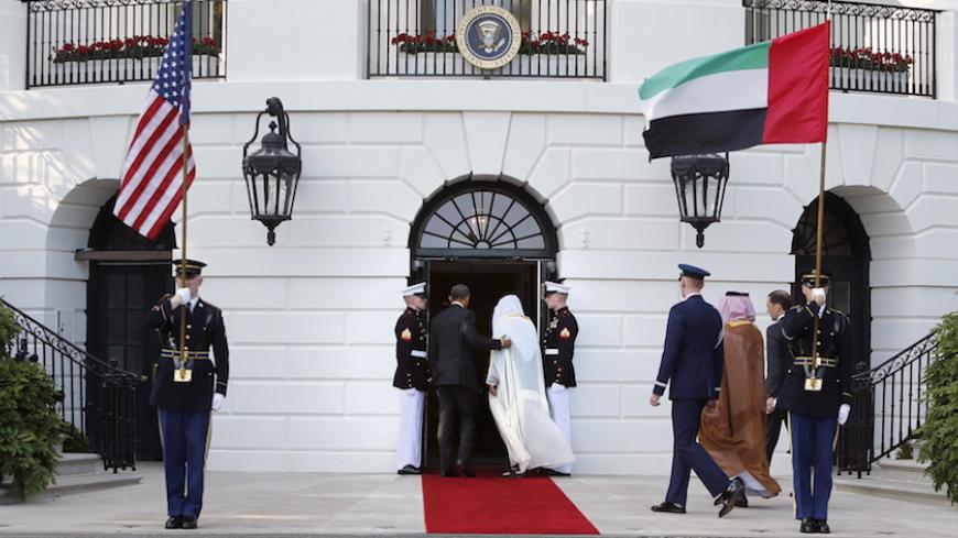 U.S. President Barack Obama (L, in doorway) walks with UAE Crown Prince Sheikh Mohammed bin Zayed al-Nahyan as he plays host to leaders and delegations from the Gulf Cooperation Council countries at the White House in Washington May 13, 2015.  REUTERS/Jonathan Ernst - RTX1CV7K