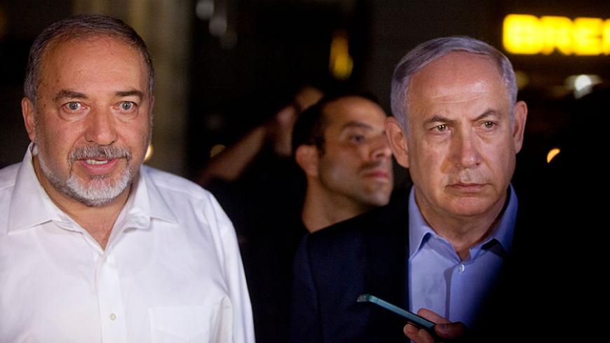 TEL AVIV, ISRAEL - JUNE 08:  Israeli Prime Minister Benjamin Netanyahu (R) and Defence Minister Avigdor Liberman  speak to the press at the scene of a shooting outside Max Brenner restaurant in Sarona Market  on June 8, 2016 in Tel Aviv, Israel. According to police reports, four Israelis were killed and several others wounded when two Palestinian gunmen open fire at the food and retail complex in central Tel Aviv.  (Photo by Lior Mizrahi/Getty Images)