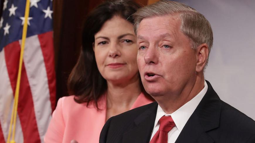 WASHINGTON, DC - SEPTEMBER 20:  Sen. Kelly Ayotte (R-NH) (L) and Sen. Lindsey Graham (R-SC) hold a news conference about military assistance to Israel at the U.S. Capitol September 20, 2016 in Washington, DC. Sen. Lindsey Graham (R-SC) is threatening to stall approval of an agreement on military assistance between the U.S. and Israel by introducing legislation that would boost the aid above what the countries agreed on.  (Photo by Chip Somodevilla/Getty Images)