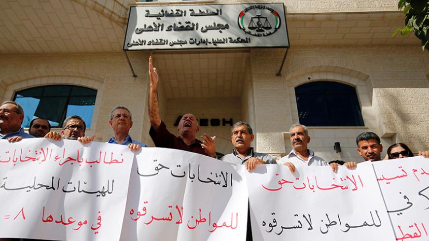 Palestinians demonstrate in front of the hight court in the West Bank city of Ramallah calling authorities not to postpone local elections,  on September 21, 2016. 
Palestinian municipal polls scheduled for October 8 were officially postponed after a court delayed a ruling on whether to hold the first vote since 2006 to include both Fatah and Hamas.

 / AFP / ABBAS MOMANI        (Photo credit should read ABBAS MOMANI/AFP/Getty Images)