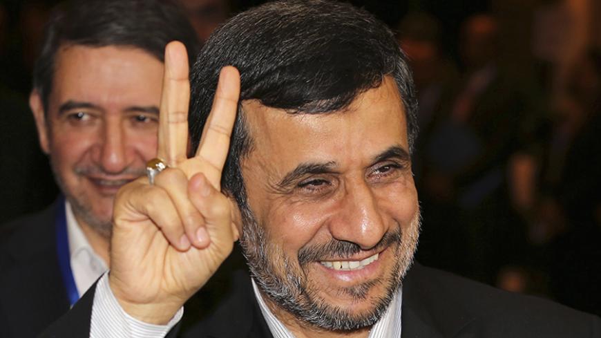 Iranian President Mahmoud Ahmadinejad gestures to photographers after meeting with Indonesian counterpart Susilo Bambang Yudhoyono in Nusa Dua, Bali November 9, 2012. Ahmadinejad said on Thursday the age of nuclear deterrence was long gone and any country still stockpiling nuclear weapons was "mentally retarded". He again denied Iran was trying to develop nuclear weapons, a day after the re-election victory of U.S. President Barack Obama, for whom Tehran's disputed nuclear programme will be one of the thorn