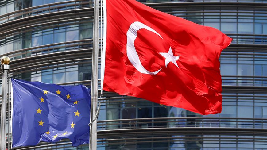 European Union (L) and Turkish flags fly outside a hotel in Istanbul, Turkey May 4, 2016. REUTERS/Murad Sezer/File Photo - RTX2EIB4