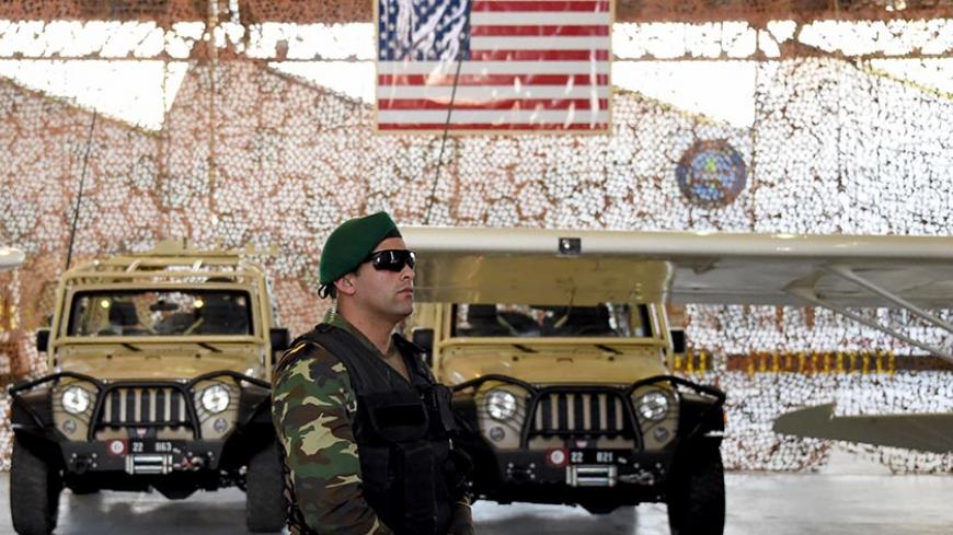 A member of the Tunisian army's special units stands in front of military equipement offered to Tunisia by the United States, on May 12, 2016, at a military base in Tunis.
The United States delivered military hardware to Tunisia to help the North African country hit by several Islamic State group attacks secure its borders and battle terrorism. The US deputy assistant secretary of defence for African affairs, said the military equipment was part of a $20 million package destined to bolster Tunisia's militar