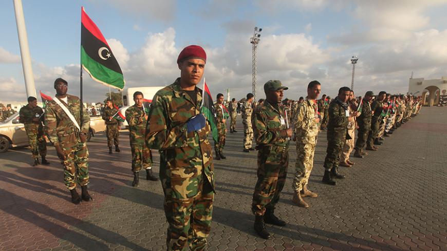 Soldiers from the National Army of Cyrenaica take part in a military parade graduation ceremony in Benghazi March 3, 2012. REUTERS/Esam Al-Fetori (LIBYA - Tags: POLITICS MILITARY) - RTR2YSN6