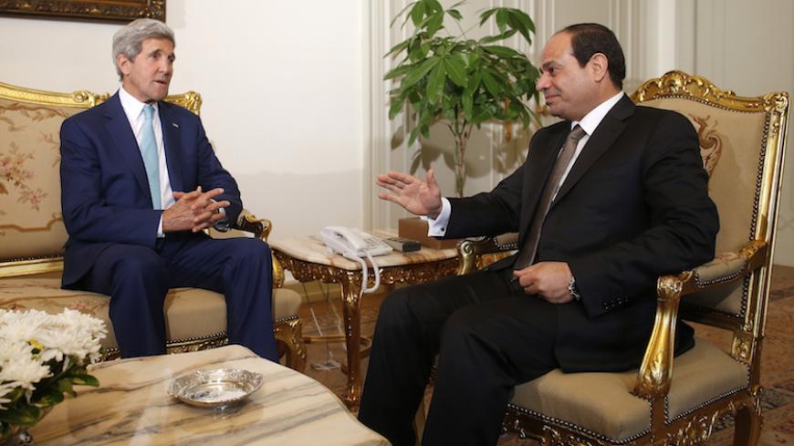U.S. Secretary of State John Kerry (L) speaks with Egyptian President Abdel Fattah al-Sisi in Cairo July 22, 2014. Israel pounded targets across the Gaza Strip on Tuesday, saying no ceasefire was near as top U.S. and U.N. diplomats pursued talks on halting fighting that has claimed more than 500 lives. Dispatched by U.S. President Barack Obama to the Middle East to seek a ceasefire, Kerry held talks on Tuesday in Cairo with Egyptian Foreign Minister Sameh Shukri. REUTERS/Charles Dharapak/Pool (EGYPT - Tags:
