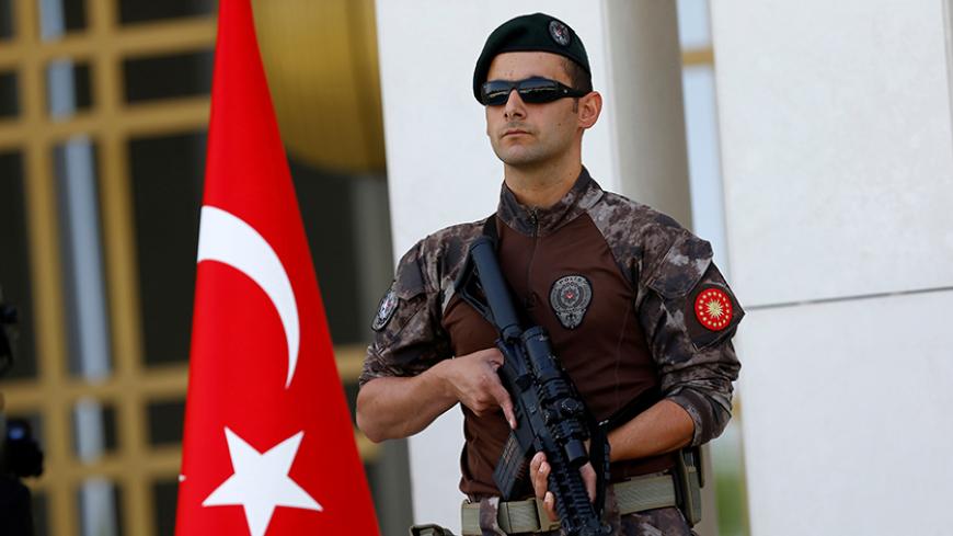 A Turkish special forces police officer guards the entrance of the Presidential Palace in Ankara, Turkey, August 5, 2016. REUTERS/Umit Bektas - RTSL6LJ