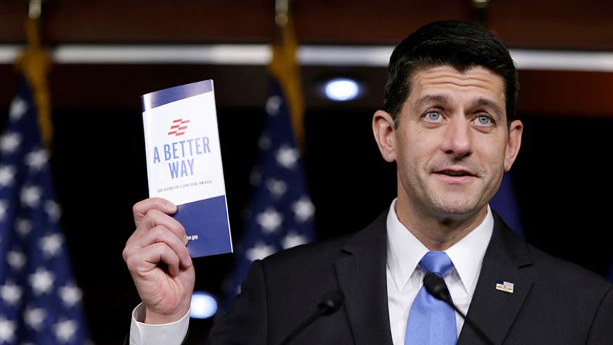 U.S. Speaker of the House Paul Ryan (R-WI) holds a copy of his party's "A Better Way" reform agenda at a news conference on Capitol Hill in Washington, DC, U.S. September 29, 2016. REUTERS/Gary Cameron - RTSQ203