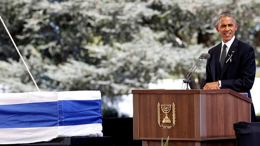 U.S President Barack Obama eulogises former Israeli President Shimon Peres as his flag-draped coffin is seen nearby, during his funeral ceremony at Mount Herzl cemetery in Jerusalem September 30, 2016. REUTERS/Baz Ratner - RTSQ5HB