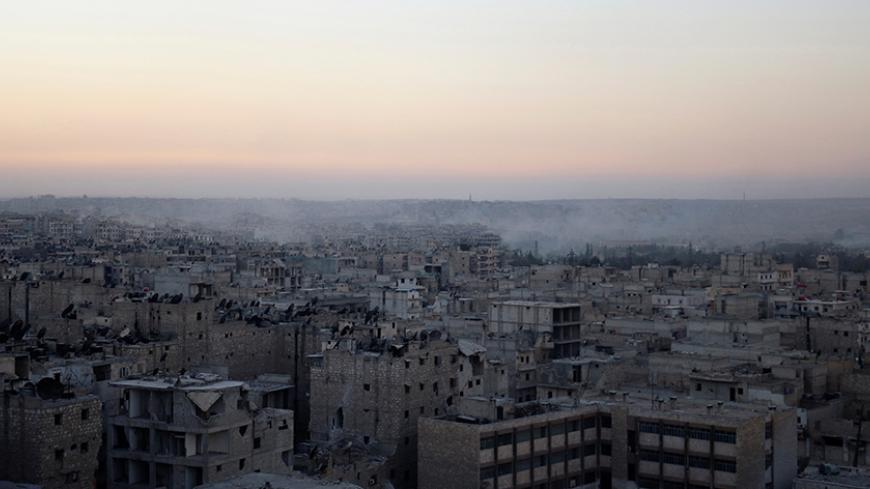 Smoke rises from Bustan al-Basha neighborhood of Aleppo, Syria, October 5, 2016. REUTERS/Abdalrhman Ismail - RTSQXEG