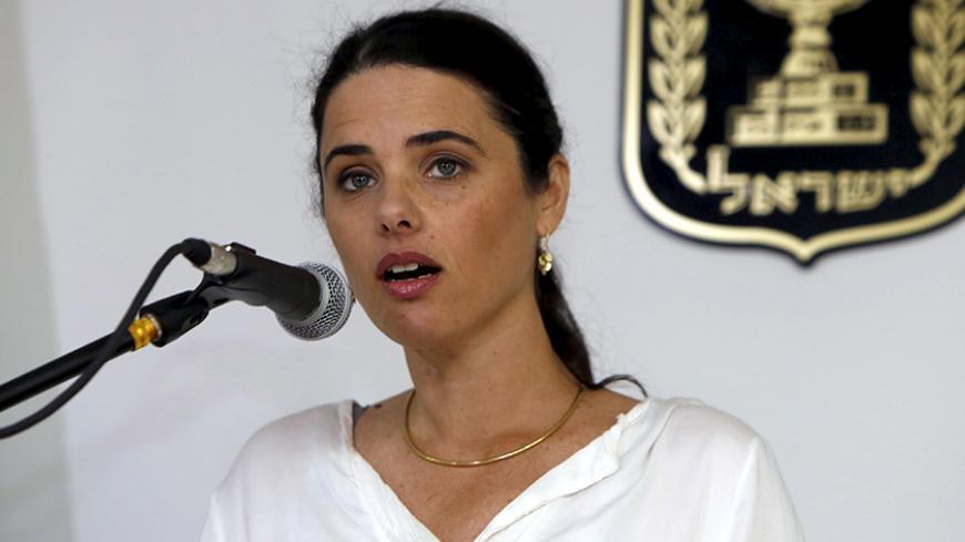 Ayelet Shaked, Israel's new Justice Minister of the far-right Jewish Home party, speaks during a ceremony at the Justice Ministry in Jerusalem May 17, 2015. Shaked said on Sunday she would seek a new balance that would rein in the powers of the Supreme Court over parliament and the government, a policy critics fear would restrict judicial oversight. REUTERS/Gali Tibbon/Pool - RTX1DBE4
