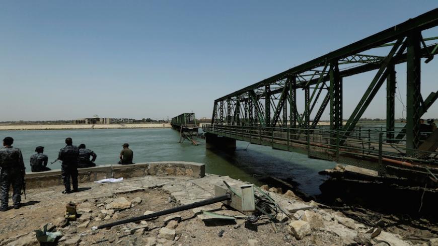 A bridge over the Euphrates river is seen in Falluja after government forces recaptured the city from Islamic State militants, Iraq, June 27, 2016. REUTERS/Thaier Al-Sudani - RTX2IHKR