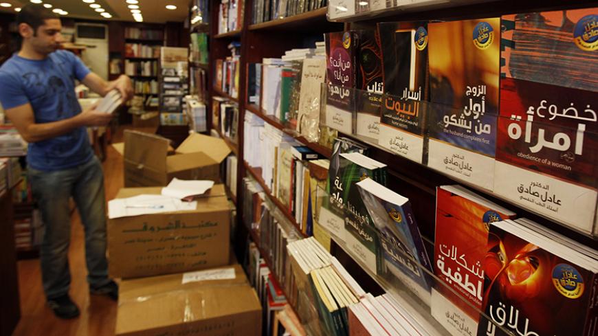 A man browses in a bookshop in downtown Cairo October 13, 2010. Poking fun at everything from the president's almost 30-year rule to the capital's frenetic traffic, satirical books are filling more shelf space in Egypt's bookshops and reflecting the frustrations of a young generation. Limited outlets for political expression, state crackdowns on organized dissent and a growing wealth gap in the Arab world's most populous state are fuelling demand for such literary satire, literary critics say. Picture taken