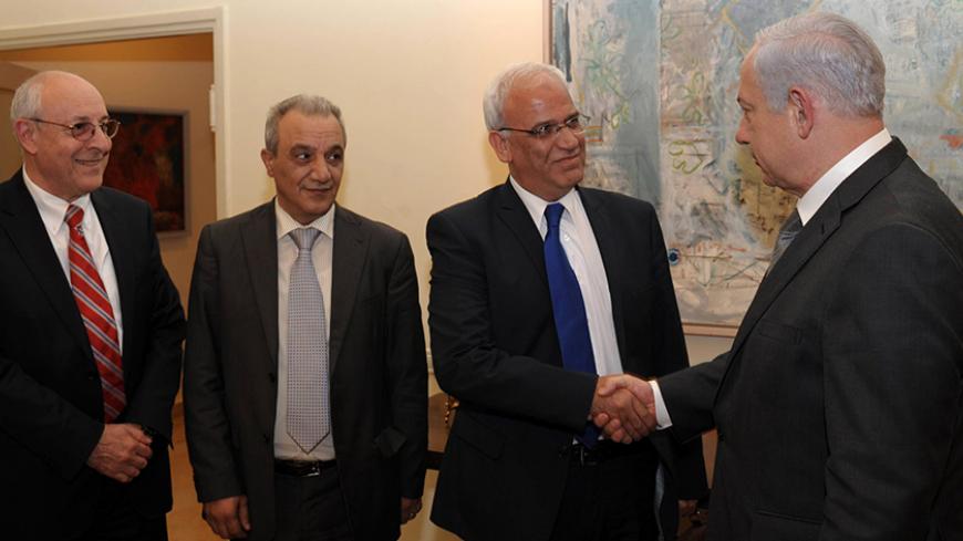 JERUSALEM, ISRAEL - APRIL 17: In this handout image provided by the Israeli Government Press Office (GPO), Israel's Prime Minister Benjamin Netanyahu shakes hands with Palestinian chief negotiator Saeb Erekat watched by Netanyahu's personal envoy, attorney Yitzhak Molcho and the head of Palestinian Authority General Intelligence Majad Faraj during their meeting on April 17, 2012 in Jerusalem, Israel. At the end of the meeting, it was agreed to release the following statement: "Israel and the Palestinian Aut