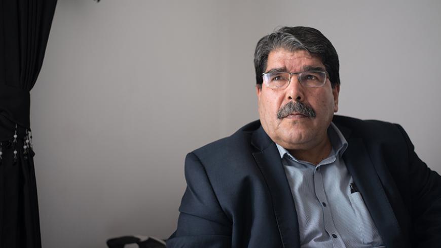 Salih Muslim, co-president of the Syrian Kurdish Democratic Union Party (PYD), listens to a question during an interview in Marseille, southern France, on December 1, 2013. PYD, the biggest Kurdish armed group, wants to establish an autonomous Kurdish state within a federal Syria and a commission is already writing the constitution of this potential state, Muslim told AFP. Syrian Kurds in the war-torn country's northeast announced last month the formation of a transitional autonomous administration after ma