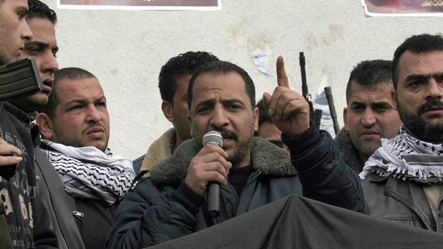 NABLUS, -: (FILES)-Jamal al-Tirawi, a spokesman for Fatah's parliamentary faction and a local leader of the Fatah-linked armed group the Al-Aqsa Martyrs Brigades, gives a press confenerce in this November 2005 file photo, in the northern West Bank city of Nablus. Tirawi,  was arrested by the Israeli military  in the Balata refugee camp outside Nablus 29 May 2007, Palestinian security sources and the Israeli army said.  It is the first arrest of a Fatah MP since a legislative election in January 2006 in whic