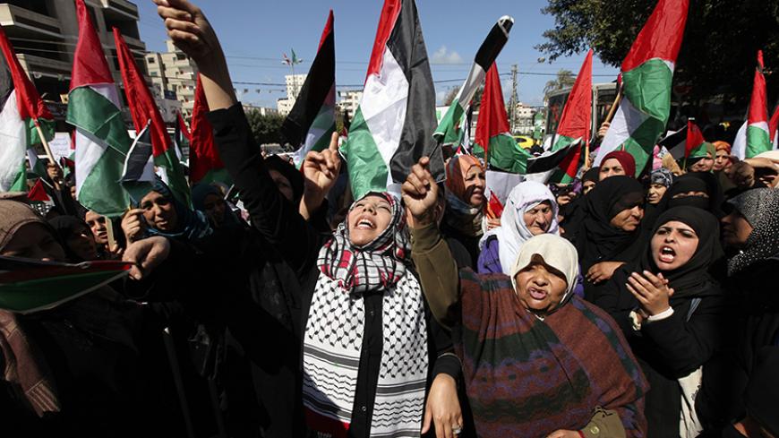 Palestinian women attend a rally calling for an end to Palestinian divisions to mark International Women's Day, in Gaza City March 8, 2011. Female protesters rallied to voice their frustrations over the unending split between Hamas and Palestinian President Mahmoud Abbas's Fatah movement, and the lack of progress towards a peace that will end Israeli occupation and finally give them a state of their own. REUTERS/Mohammed Salem (GAZA - Tags: CIVIL UNREST ANNIVERSARY) - RTR2JM2Z