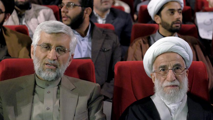 Ayatollah Ahmad Jannati (R), a candidate for the upcoming vote on the Assembly of Experts, and Iran's former chief negotiator Saeed Jalili attend a conservatives election campaign gathering in Tehran February 24, 2016. The campaign gathering was titled "No to UK Meddling". REUTERS/Raheb Homavandi/TIMA  ATTENTION EDITORS - THIS IMAGE WAS PROVIDED BY A THIRD PARTY. FOR EDITORIAL USE ONLY.   - RTX28EQJ