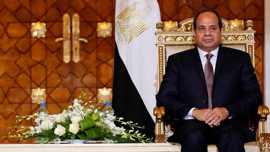 Egypt's President Abdel Fattah al-Sisi attends during signing of agreements ceremony with Sudanese President Omar Hassan al-Bashir (unseen) at the El-Thadiya presidential palace in Cairo, Egypt October 5, 2016. Picture taken October 5, 2016. REUTERS/Amr Abdallah Dalsh - RTX2Q29F