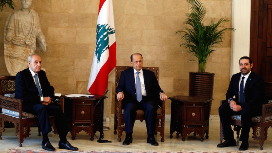 Newly elected Lebanese president Michel Aoun (C) sits with former prime minister Saad al-Hariri (R), who is expected to lead the new Lebanese government, and Parliament Speaker Nabih Berri (L) at the presidential palace in Baabda, near Beirut, Lebanon November 3, 2016. REUTERS/Mohamed Azakir - RTX2ROR8