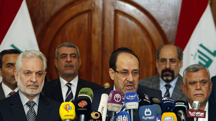 Iraqi Vice President Nuri al-Maliki speaks during a news conference in Baghdad November 29, 2014.   REUTERS/Ahmed Saad (IRAQ - Tags: CIVIL UNREST POLITICS) - RTR4G1I1