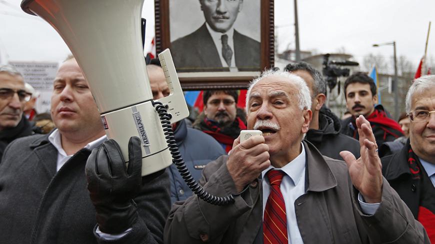 Dogu Perincek, Chairman of the Turkish Workers' Party addresses supporters at the end of a hearing at the European court of Human Rights in Strasbourg, January 28, 2015. The European Court of Human Rights holds an hearing on Wednesday on the case of Perincek against Switzerland. Perincek was found guilty of racial discrimination by a Swiss Police Court for having publicly denied the characterisation of genocide, without calling into question the existence of massacres and deportations of Armenians in 1915 i