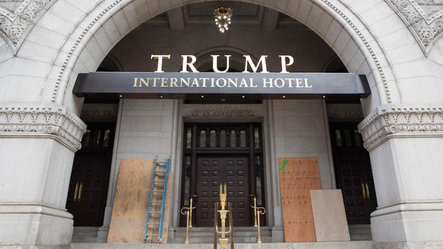 Plywood covers graffiti at an entrance to the Trump International Hotel in Washington, U.S., October 2, 2016.    REUTERS/Joshua Roberts - RTSQFR2