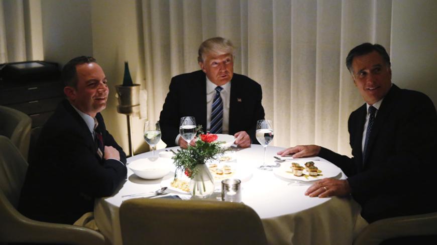 U.S. President-elect Donald Trump sits at a table for dinner with former Massachusetts Governor Mitt Romney (R) and his choice for White House Chief of Staff Reince Priebus (L) at Jean-Georges at the  Trump International Hotel & Tower in New York, U.S., November 29, 2016.  REUTERS/Lucas Jackson - RTSTX8X