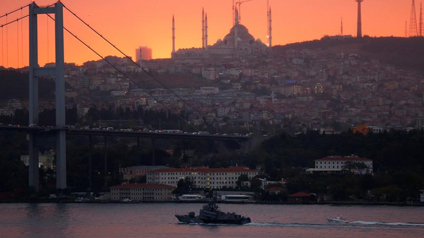 Russian Navy's Tarantul-class corvette Ivanovets is escorted by a Turkish Navy Coast Guard boat as it sets sail in the Bosphorus, on its way to the Black Sea, in Istanbul, Turkey, October 19, 2016. REUTERS/Murad Sezer     TPX IMAGES OF THE DAY      - RTX2PFTI