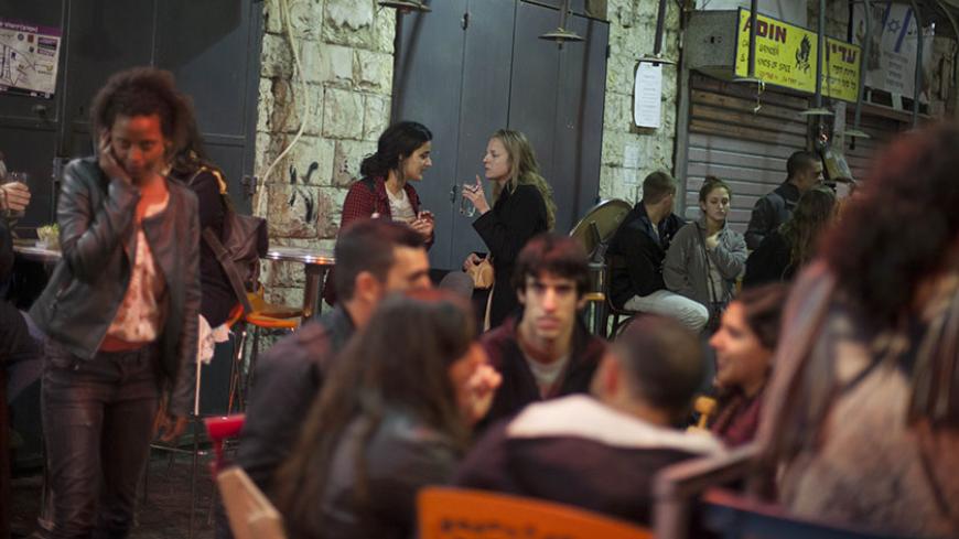 JERUSALEM, ISRAEL - FEBRUARY 27:  (ISRAEL OUT)  Israelis enjoy at Shuka bar in Mahane Yehuda open market on February 27, 2014 in Jerusalem, Israel. The Mahane Yehuda Market is over 100 years old. Often reffered to as "The Shuk", the market in the heart of Jerusalem is a popular attraction with both locals and international tourists alike.  (Photo by Lior Mizrahi/Getty Images)