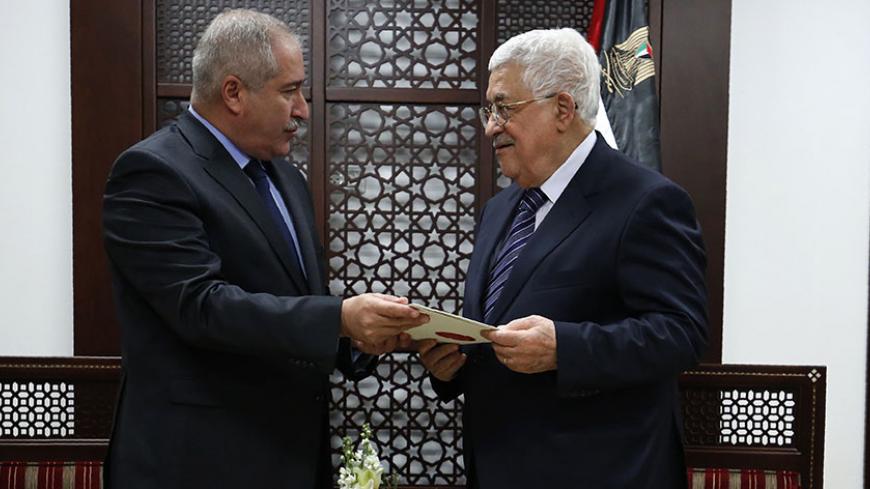 Palestinian Prime Minister Mahmud Abbas (R) meets with Jordanian Foreign Minister Nasser Judeh at the Muqataa, the Palestinian Authority headquarters in the West Bank city of Ramallah on December 28, 2016.  / AFP / ABBAS MOMANI        (Photo credit should read ABBAS MOMANI/AFP/Getty Images)