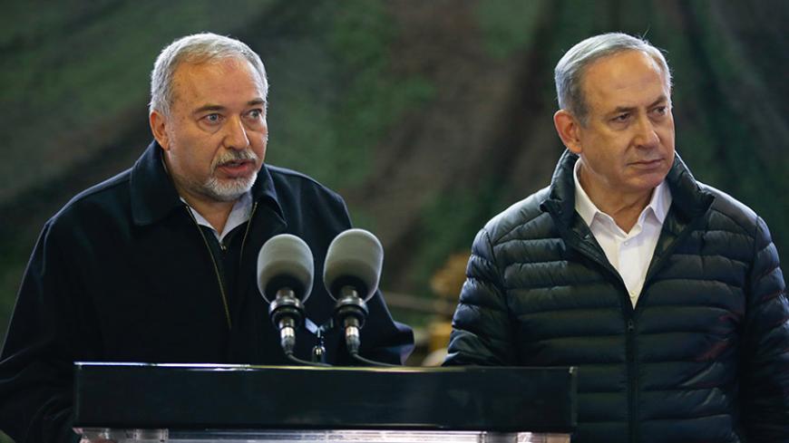 Israel's Defense Minister Avigdor Lieberman speaks as Israeli Prime Minister Benjamin Netanyahu stands next to him during a visit to an army base in the West Bank settlement of Beit El near Ramallah January 10, 2017.   REUTERS/Baz Ratner - RTX2YAG3