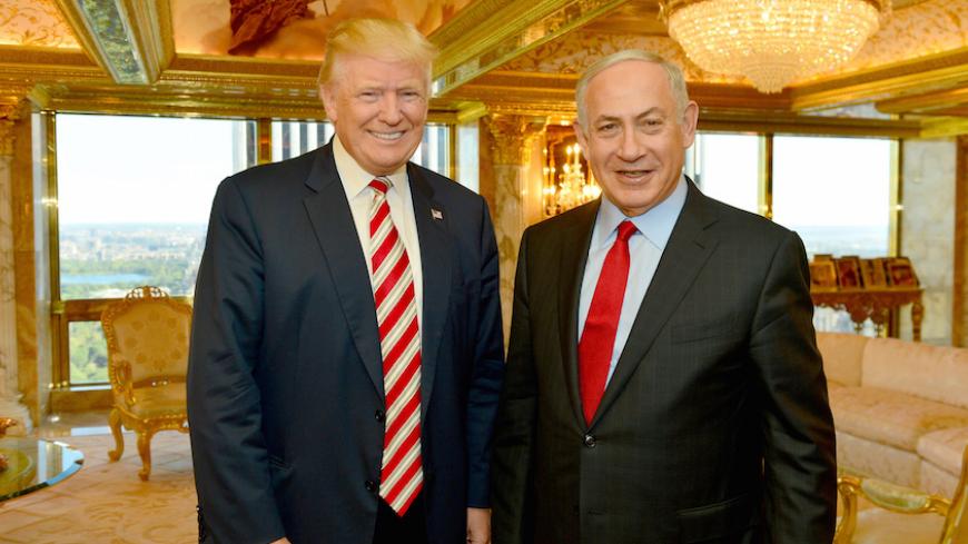 FILE PHOTO: Israeli Prime Minister Benjamin Netanyahu (R) stands next to Republican U.S. presidential candidate Donald Trump during their meeting in New York, September 25, 2016.      Kobi Gideon/Government Press Office (GPO)/Handout via REUTERS/File Photo         ATTENTION EDITORS - THIS IMAGE HAS BEEN SUPPLIED BY A THIRD PARTY. FOR EDITORIAL USE ONLY. - RTX2YZB7