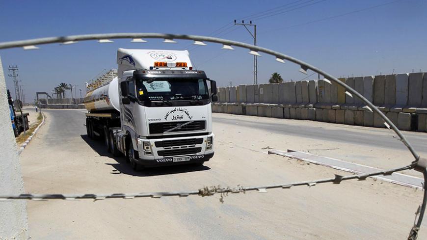 A truck loaded with goods enters Rafah town through the Kerem Shalom commercial crossing between Israel and the southern Gaza Strip on April 27, 2014 as the crossing reopened after the Jewish Passover holidays. The coastal strip, whose air and sea lanes are blocked by Israel, has three land crossings; Erez and Kerem Shalom with Israel and Rafah with Egypt.   AFP PHOTO / SAID KHATIB        (Photo credit should read SAID KHATIB/AFP/Getty Images)