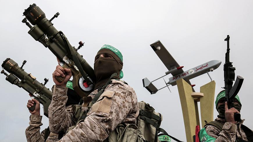 TOPSHOT - Members of the Ezzedine al-Qassam Brigades, the military wing of the Palestinian Islamist movement Hamas, attend a memorial in the southern Gaza Strip town of Rafah on January 31, 2017, for Mohamed Zouari, a 49-year-old Tunisian engineer and drone expert, who was murdered at the wheel of his car outside his house in Tunisia in December 2016. 
The armed wing of Hamas said that the Jewish state was responsible for the murder in eastern Tunisia, of Mohamed Zaouari, described as a leader of the Islami