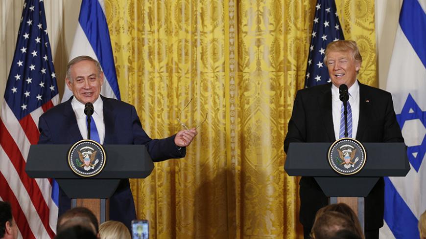 U.S. President Donald Trump (R) laughs with Israeli Prime Minister Benjamin Netanyahu at a joint news conference at the White House in Washington, U.S., February 15, 2017.     REUTERS/Kevin Lamarque  - RTSYUD8