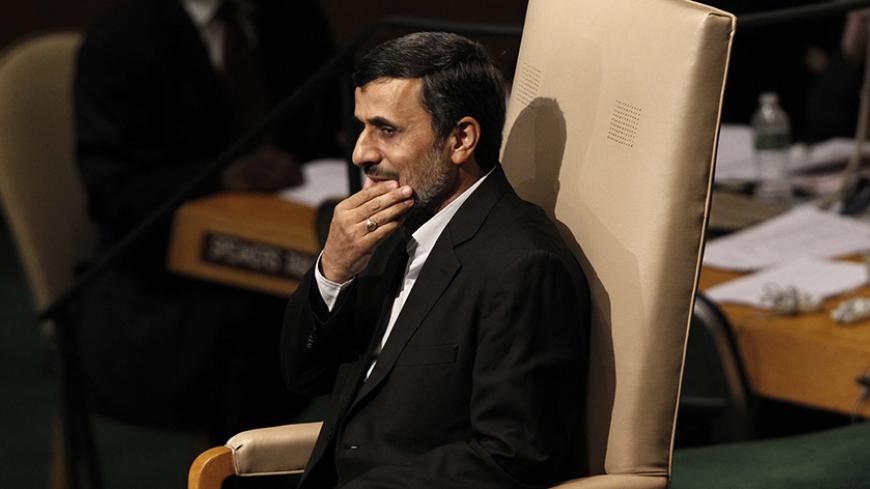 Iran's President Mahmoud Ahmadinejad sits in a chair after addressing the 67th United Nations General Assembly at the U.N. Headquarters in New York, September 26, 2012. REUTERS/Keith Bedford (UNITED STATES - Tags: POLITICS) - RTR38G44