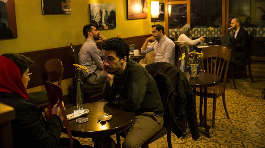 Iranian youth sit at the Jee Café in the capital Tehran on February 25, 2016. / AFP / BEHROUZ MEHRI        (Photo credit should read BEHROUZ MEHRI/AFP/Getty Images)