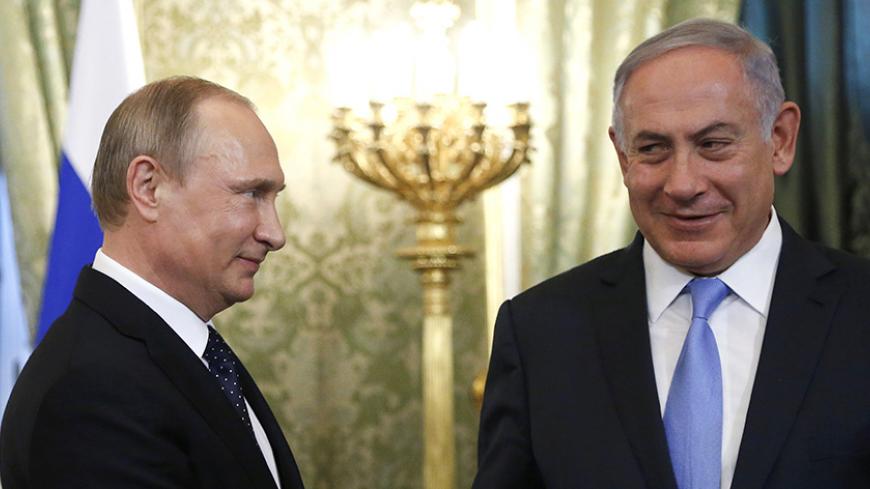 Russian President Vladimir Putin (L) welcomes Israeli Prime Minister Benjamin Netanyahu during a meeting at the Kremlin in Moscow, Russia June 7, 2016. REUTERS/Maxim Shipenkov/Pool - RTSGEGA
