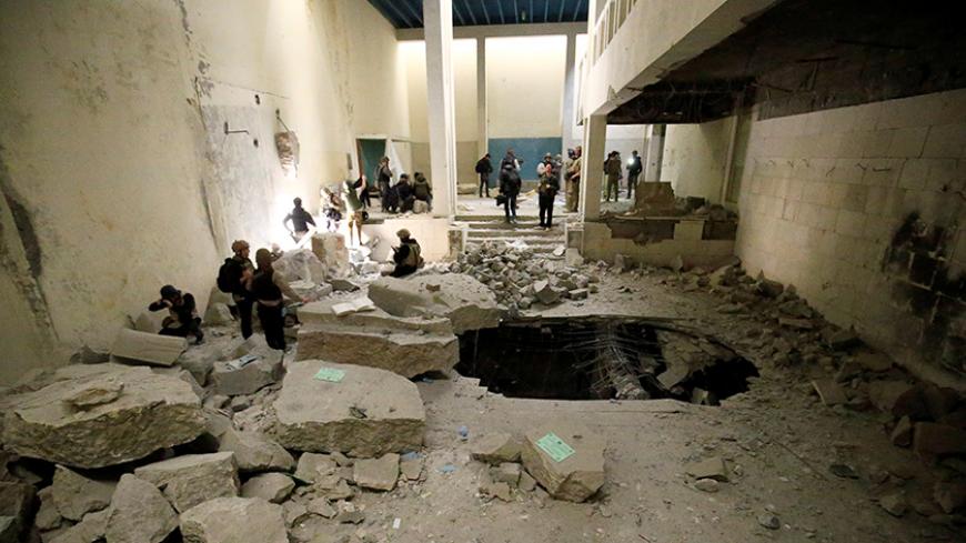 A view of a destroyed museum, where Islamic State militants filmed themselves destroying priceless statues and sculptures in 2015, during a battle against the militants in Mosul, Iraq, March 11, 2017. REUTERS/Thaier Al-Sudani - RTX30KNF