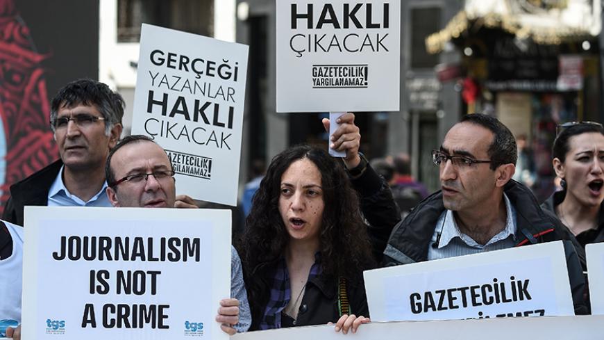 Journalists hold placards reading "journalists will be freed , they will write again" during a demonstration for the World Press Freedom Day on the Istiklal avenue, in Istanbul, on May 3, 2017.
According to the P24 press freedom website on April 4, 2017, there are 141 journalists behind bars in Turkey, most of whom were detained as part of the state of emergency imposed after the failed coup. / AFP PHOTO / OZAN KOSE        (Photo credit should read OZAN KOSE/AFP/Getty Images)