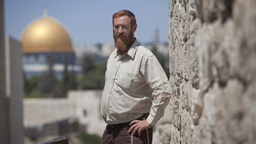Yehuda Glick, an activist of the "temple mount faithful" group, poses for a photo in Jerusalem June 30, 2011. Glick was shot and severely wounded in Jerusalem on October 29, 2014 as he left a conference promoting a Jewish campaign to permit praying at a compound in the Old City that that has become a flashpoint as both Jews and Muslims regard it as a holy site, Israeli officials said. Israeli police shot dead a Palestinian on Thursday after he fired at them resisting arrest in East Jerusalem hours after the