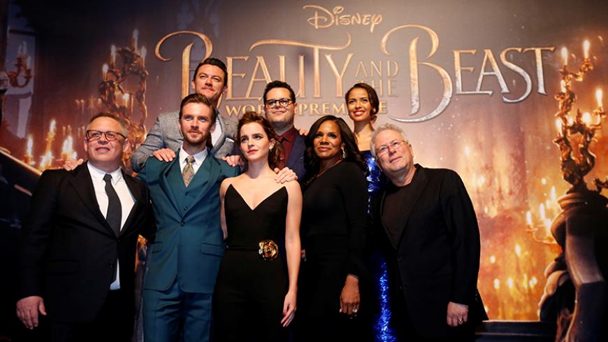 Director of the movie Bill Condon and composer Alan Menken pose with cast members Dan Stevens, Luke Evans, Emma Watson, Josh Gad, Audra McDonald and Gugu Mbatha-Raw at the premiere of "Beauty and the Beast" in Los Angeles, California, U.S. March 2, 2017.   REUTERS/Mario Anzuoni - RTS118KT