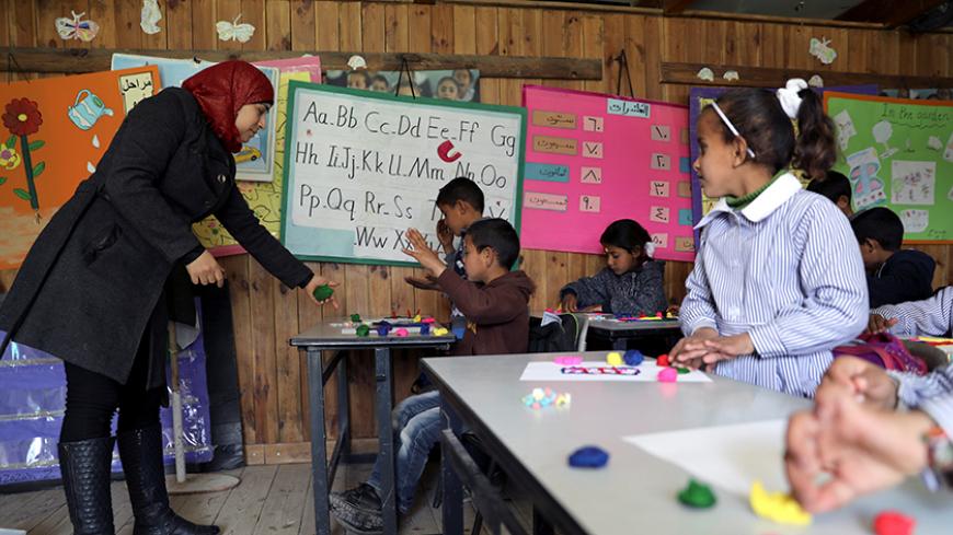Bedouin Palestinian schoolchildren attend a lesson inside a classroom at their school in al-Khan al-Ahmar village near the West Bank city of Jericho February 23, 2017. REUTERS/ Ammar Awad - RTSZZHG