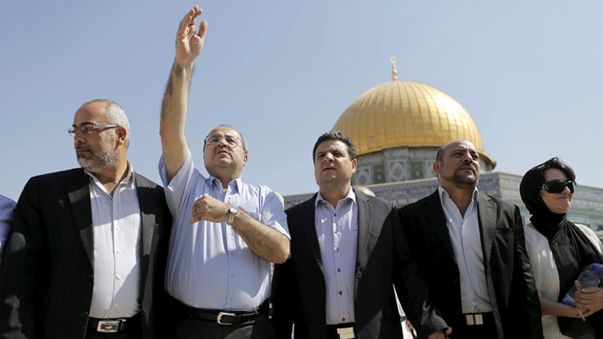 Israeli Arab lawmakers from the Joint Arab List (from L to R) Osama Saadi, Ahmed Tibi, Ayman Odeh, Masud Ganaim and Haneen Zoabi stand in front of the Dome of the Rock during a visit to the compound known to Muslims as Noble Sanctuary and to Jews as Temple Mount in Jerusalem's Old City July 28, 2015. REUTERS/Ammar Awad  - RTX1M321