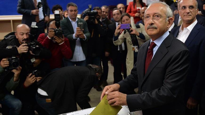 Turkey's main opposition Republican People's Party (CHP) leader Kemal Kilicdaroglu casts his ballot at a polling station in Ankara, Turkey, November 1, 2015. Turks began voting on Sunday amid worsening security and economic worries in a snap parliamentary election that could profoundly impact the divided country's trajectory and that of President Tayyip Erdogan. The parliamentary poll is the second in five months, after the ruling AK Party founded by Erdogan failed to retain its single-party majority in Jun